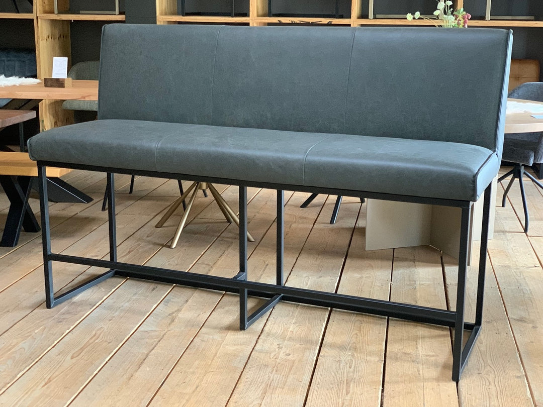 Moderne Hochbank aus Leder mit dunkelgrauem Bezug und stabilem schwarzem Metallgestell im Industrial-Stil, ideal für Essbereich oder Küche.